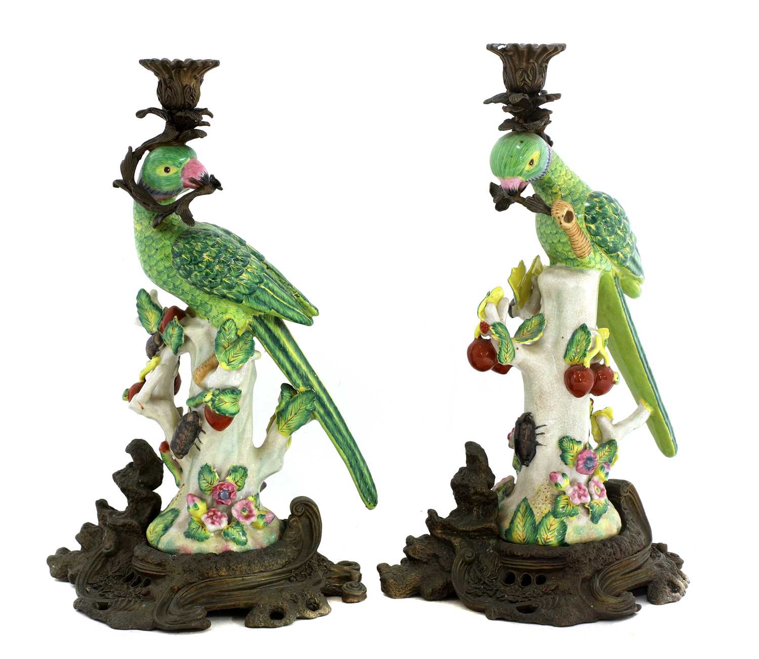 Lot 163 - A pair of gilt brass mounted pottery parrot candlesticks