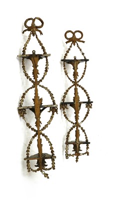 Lot 191 - A pair of vertical hanging gilt wall shelves