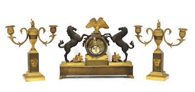 Lot 482 - A French two-colour gilt-bronze three-piece clock garniture