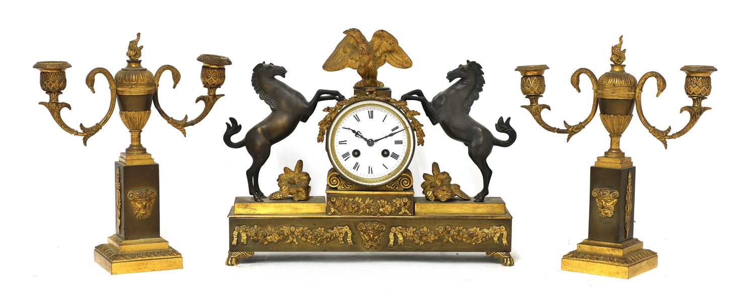 Lot 482 - A French two-colour gilt-bronze three-piece clock garniture