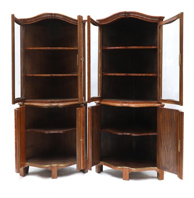 Lot 632 - A pair of French Louis XVI kingwood corner cupboards