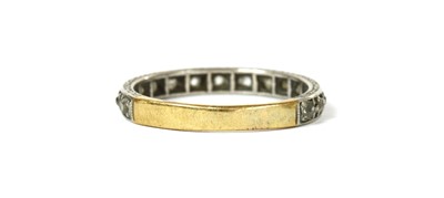 Lot 1176 - A platinum and gold diamond eternity ring