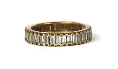 Lot 1180 - A gold diamond set full eternity ring