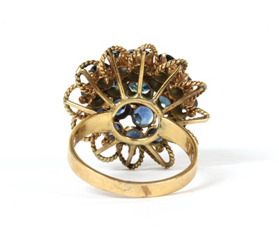 Lot 128 - A gold sapphire bombé cluster ring