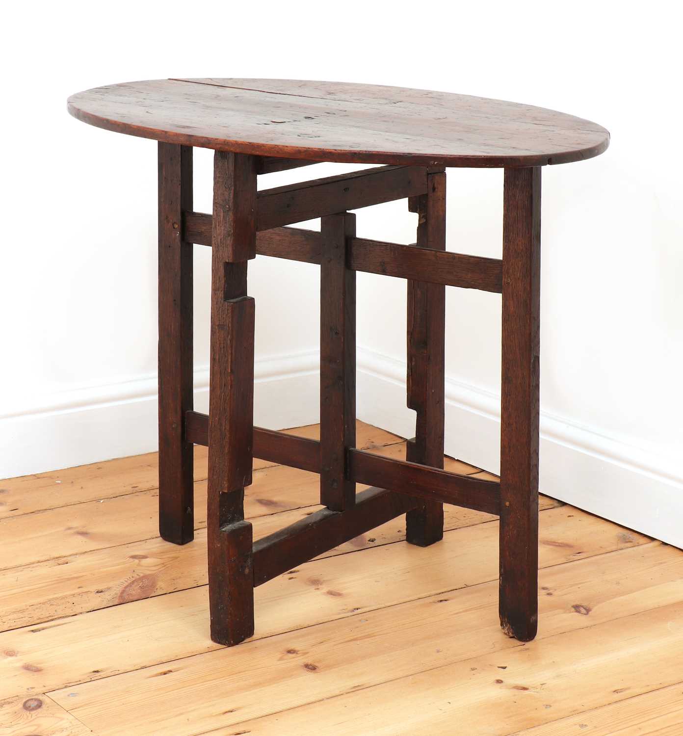 Lot 238 An oak folding occasional table