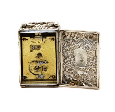 Lot 9 - A late Victorian silver miniature carriage clock