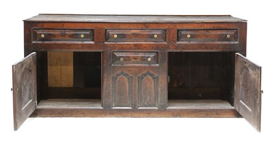 Lot 210 - An oak dresser with cupboards and drawers