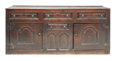 Lot 210 - An oak dresser with cupboards and drawers