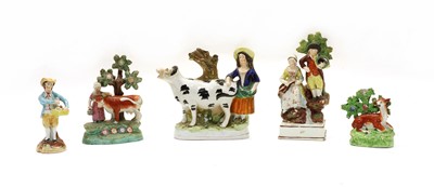 Lot 145 - A Walton type pearlware milkmaid and cow figure group