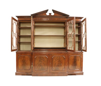 Lot 437 - A George III style mahogany breakfront bookcase