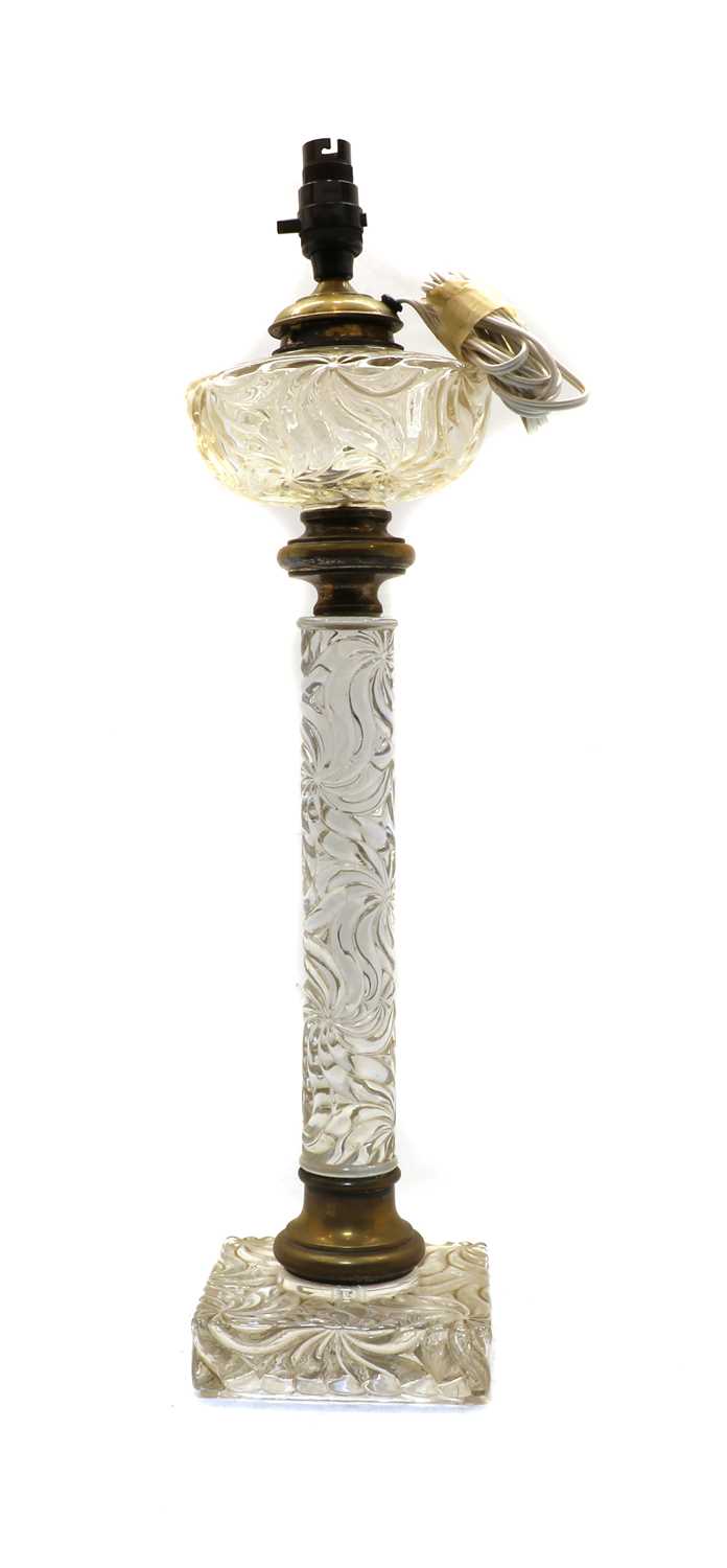 Lot 92 - A late 19th century heavy moulded glass and brass oil lamp