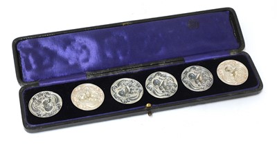 Lot 27 - A cased set of six Art Nouveau silver buttons
