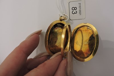 Lot 83 - A Shakudo double sided oval hinged locket, c.1880