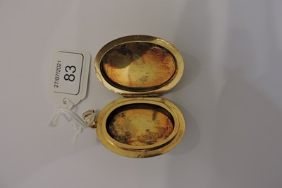 Lot 83 - A Shakudo double sided oval hinged locket, c.1880
