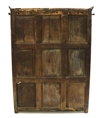 Lot 425 - A panelled oak cupboard