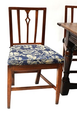 Lot 653 - A set of six George III oak and elm 'Country Sheraton' chairs