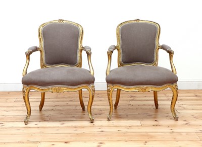 Lot 646 - A pair of gilt-framed Louis XV-style armchairs