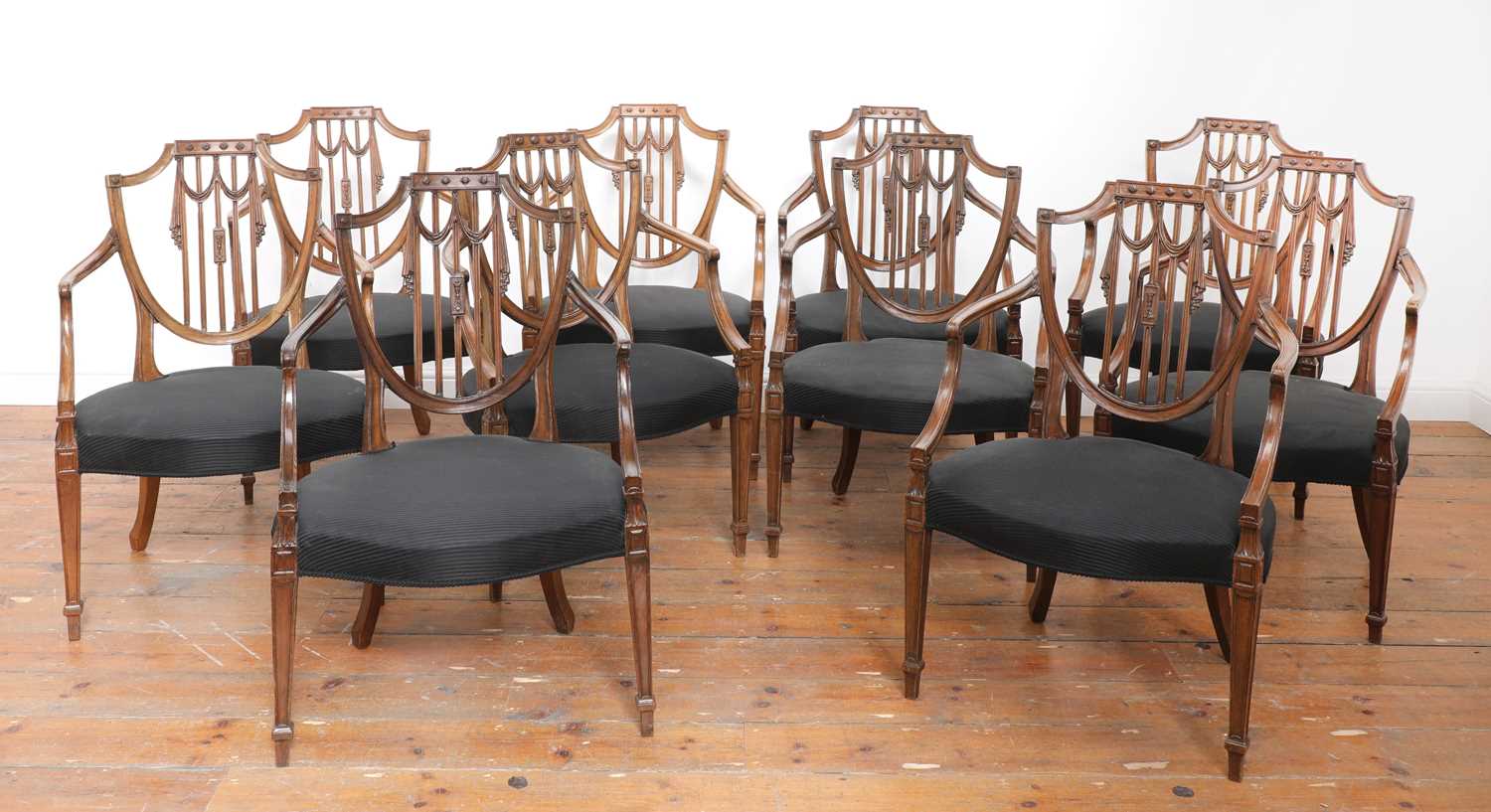 Lot 195 - A set of ten mahogany shield back dining chairs