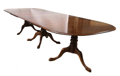 Lot 595 - A mahogany triple pedestal dining table
