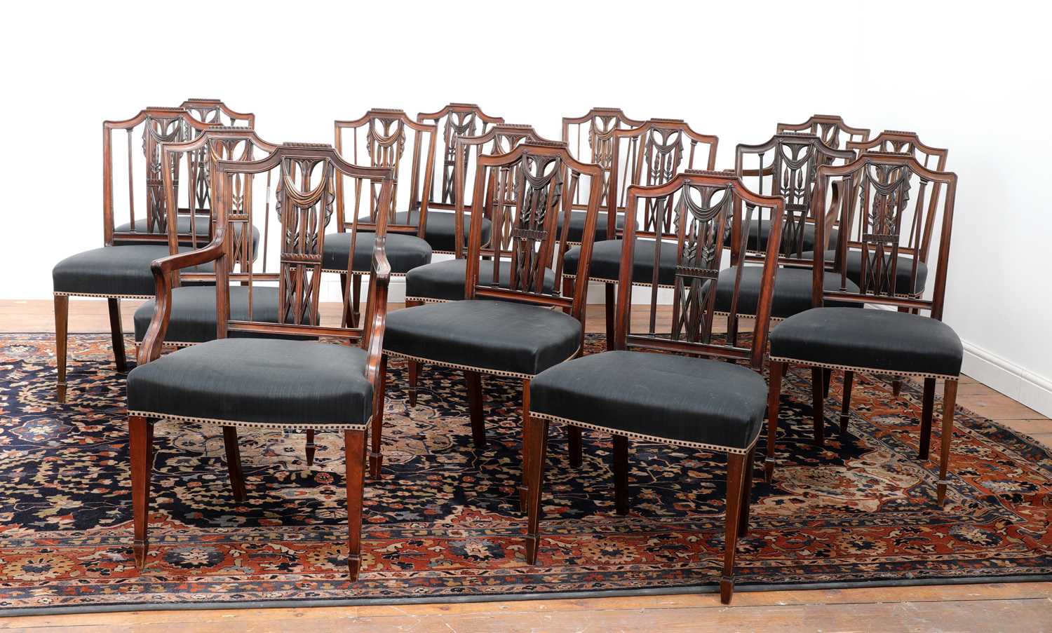 Lot 484 - A composed set of sixteen Gustavian mahogany dining chairs