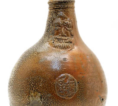 Lot 126 - A stoneware bellarmine jug