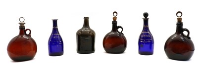 Lot 276 - An 18th century olive green mallet shaped glass bottle