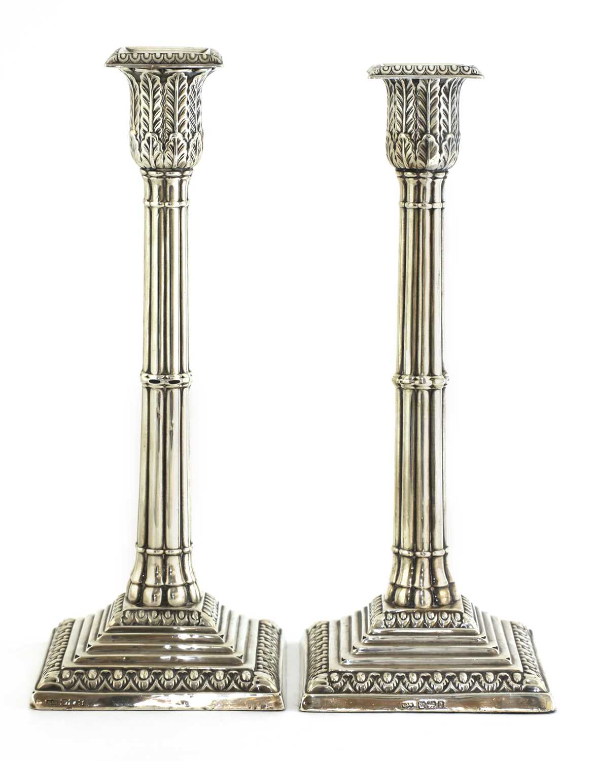 Lot 83 - A pair of silver cluster column table candlesticks