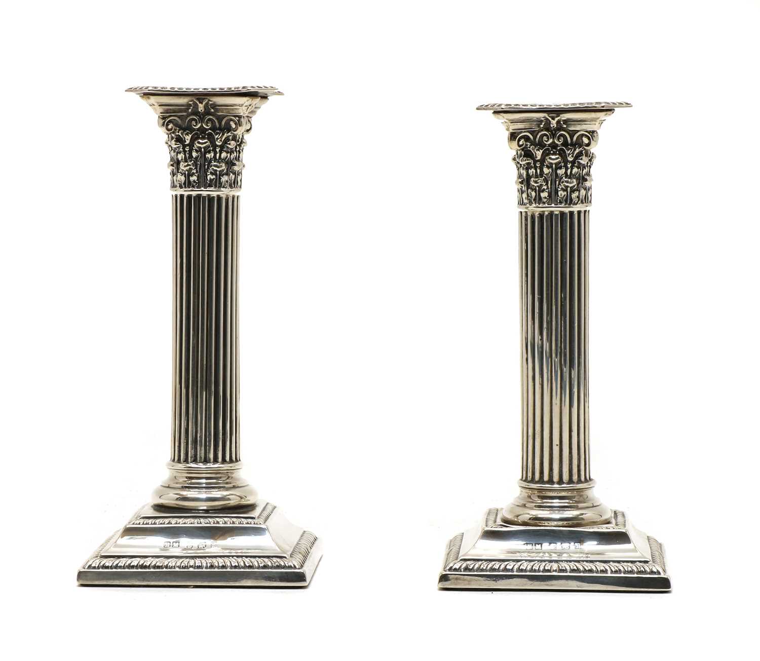 Lot 39 - A pair of modern dwarf silver pillar candlesticks