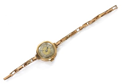 Lot 238 - A ladies' 9ct gold Tavannes mechanical bracelet watch