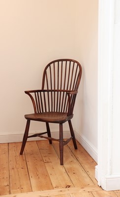 Lot 529 - A yew and elm high hoop back Windsor chair