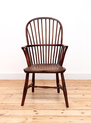 Lot 529 - A yew and elm high hoop back Windsor chair