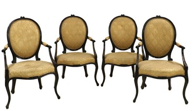 Lot 429 - A set of four George III style mahogany open armchairs