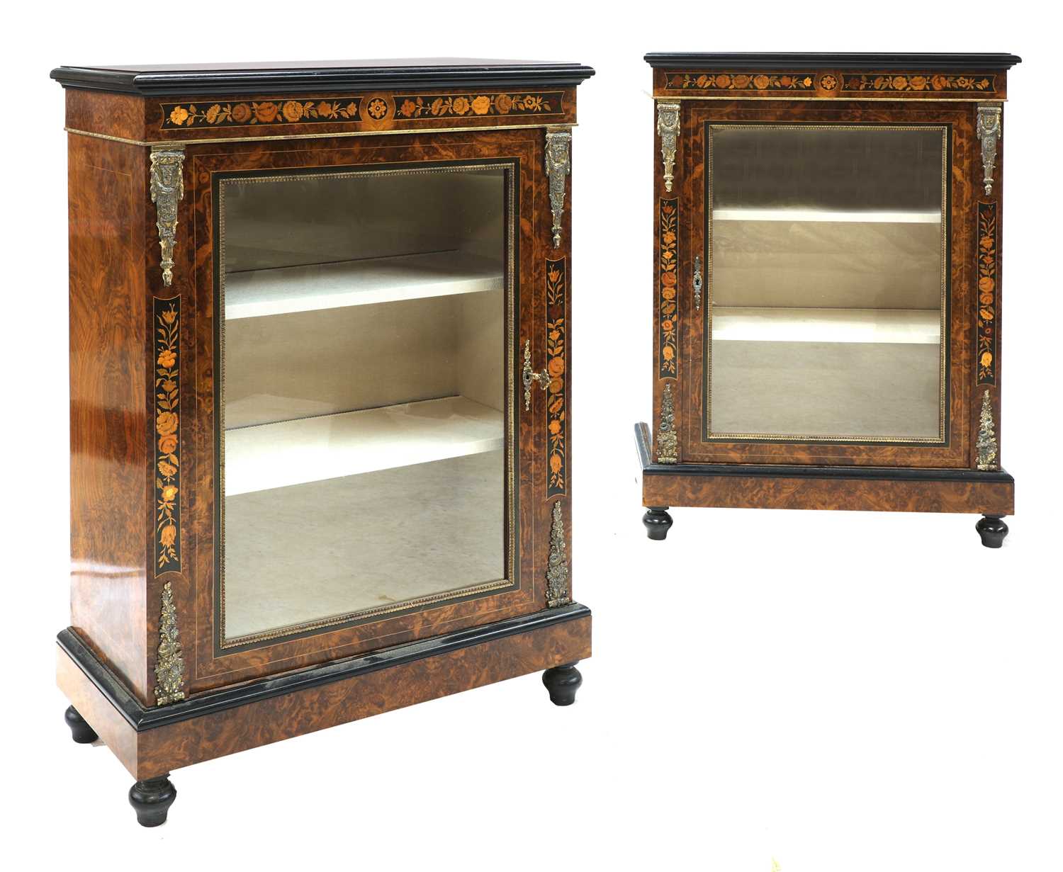 Lot 182 - A pair of Victorian figured walnut pier cabinets