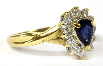 Lot 124 - A gold sapphire and diamond cluster ring