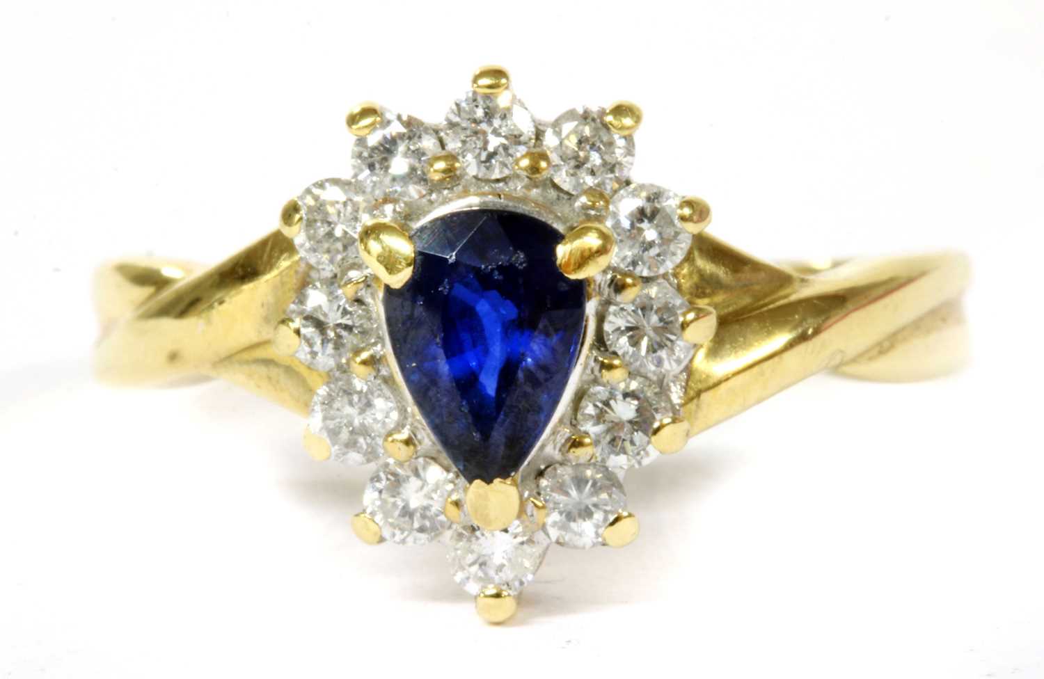 Lot 124 - A gold sapphire and diamond cluster ring