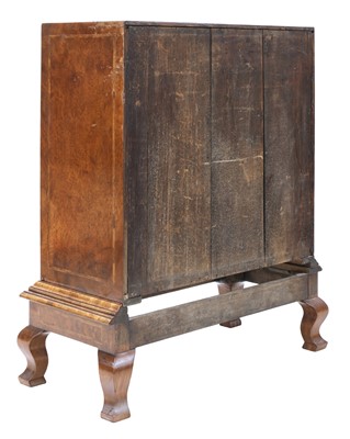 Lot 435 - A walnut chest on stand