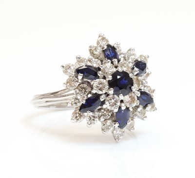 Lot 291 - A white gold sapphire and diamond snowflake cluster ring
