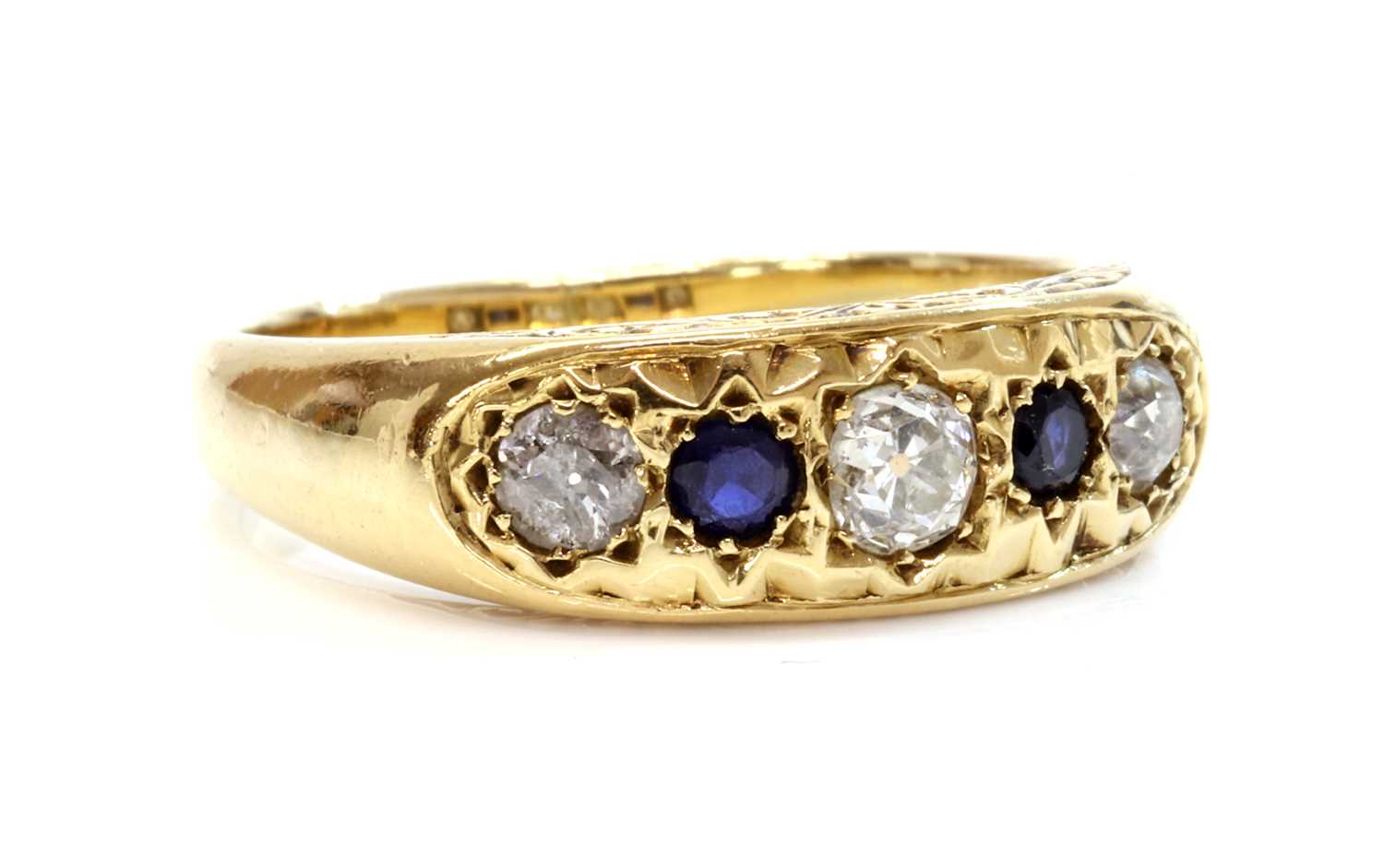 Lot 136 - A gold five stone diamond and sapphire ring