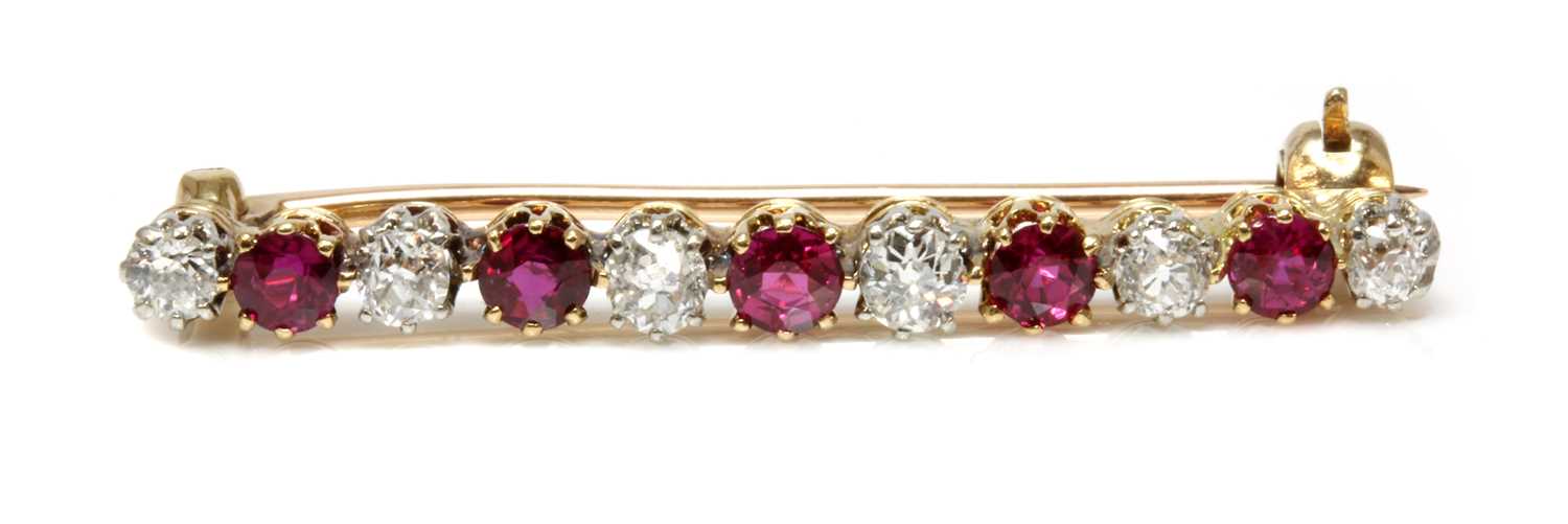 Lot 45 - A ruby and diamond two colour bar brooch