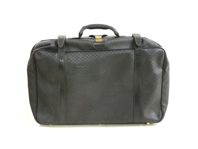 Lot 270 - A Gucci vintage black coated canvas suitcase