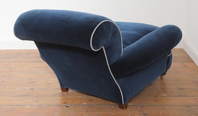 Lot 595 - A deep-seated Howard-style armchair