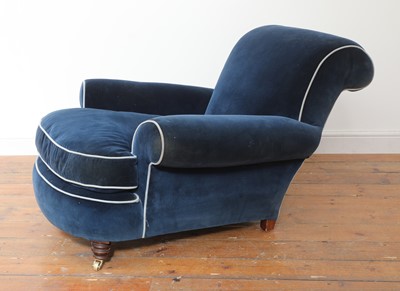 Lot 595 - A deep-seated Howard-style armchair