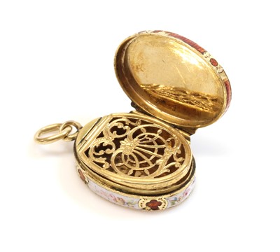 Lot 25 - A miniature gold oval locket form vinaigrette