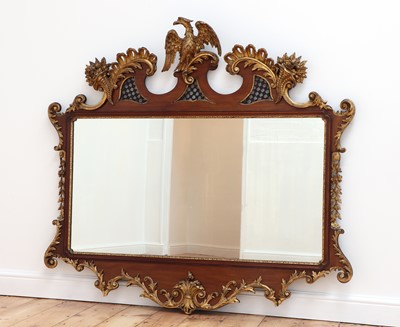 Lot 492 - A large George II-style mahogany and parcel-gilt mirror