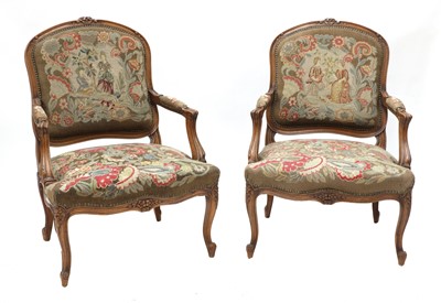 Lot 465 - A pair of French Louis XV-style beech fauteuils