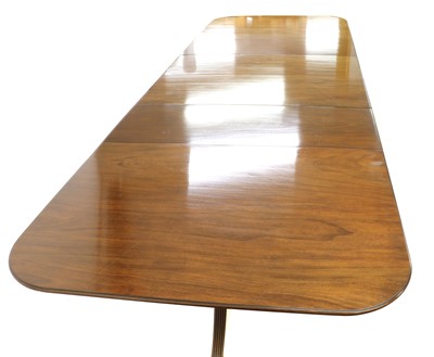 Lot 371 - A Regency-style mahogany triple pedestal dining table