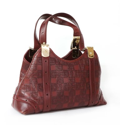 Lot 269 - A Gucci red leather horse-bit shoulder bag