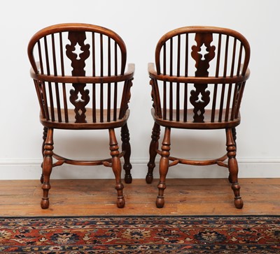 Lot 428 - A pair of yew and elm low hoop back Windsor chairs