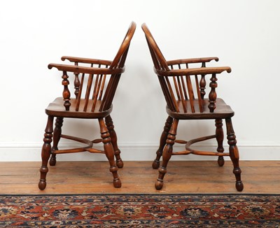 Lot 428 - A pair of yew and elm low hoop back Windsor chairs