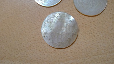 Lot 141 - Twenty six Chinese engraved mother of pearl gaming counters